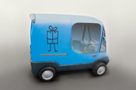 Fotografía de la maqueta del vehículo eléctrico Shoppi con la identidad gráfica aplicada sobre la carrocería